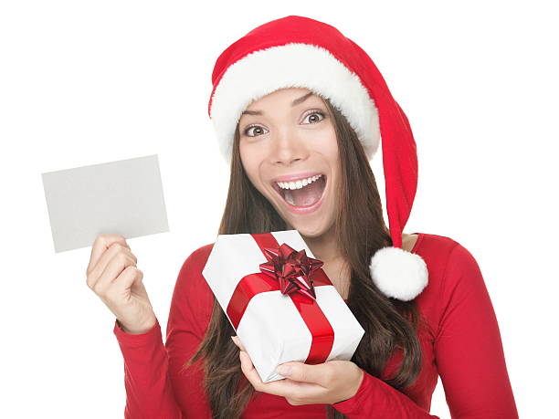istock Santa girl showing blank sign 153774374