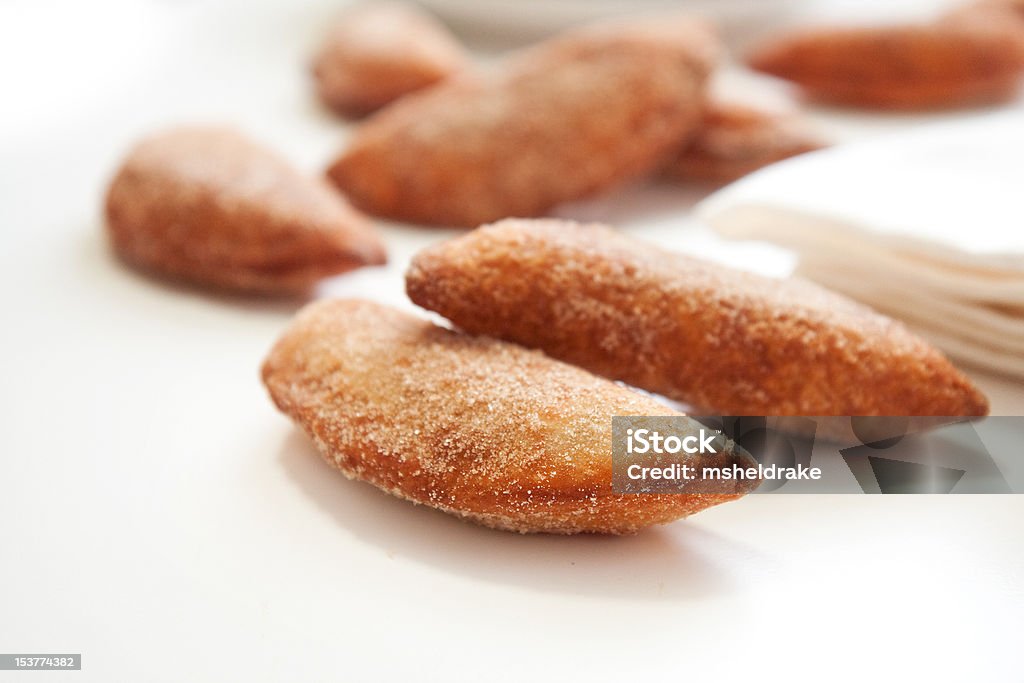 Fried Cherry Pie An abundance of Sweet fried cherry turnovers on white Cherry Stock Photo