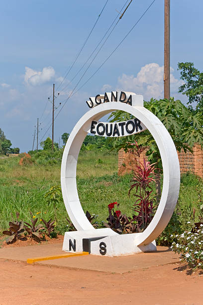 Equator line crossing sign monument in Uganda Equator line crossing sign monument in Uganda placed on the road Kampala-Masaka between Buwama and Lukaya. equator line stock pictures, royalty-free photos & images