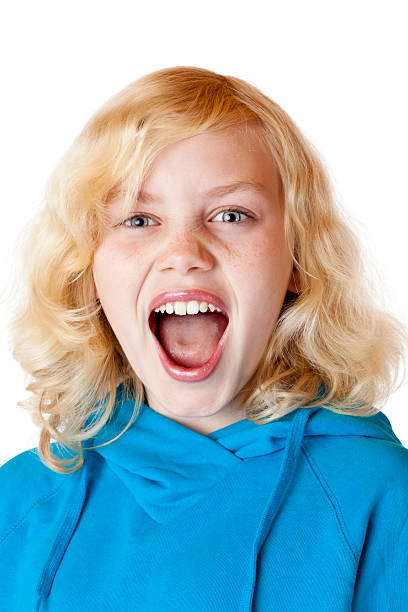 istock Young blond girl screams loudly at camera 153775222