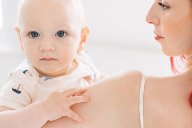 istock Redhead mom and cute baby son enjoying 1537757333