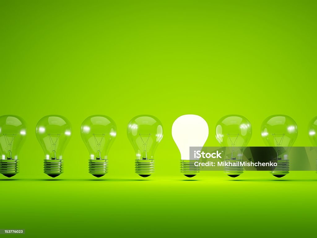 Light bulbs Turn on bulb on green background Light Bulb Stock Photo