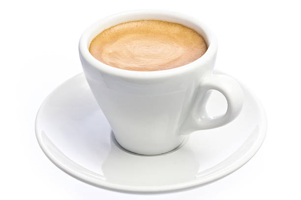 A cup of espresso coffee with foam isolated over white