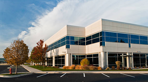White Office Building at Dusk White office building at sun set, blue sky, cloudscape. office park stock pictures, royalty-free photos & images