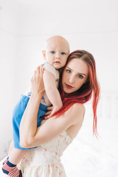 istock Redhead mom and cute baby son enjoying 1537768119