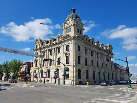 Moose Jaw,Saskatchewan, Canada- July 2,2023:  Main Street Moose Jaw Saskatchewan.  Summertime. Old Historical buildings line streets. Featuring the Magnificent Edwardian City Hall