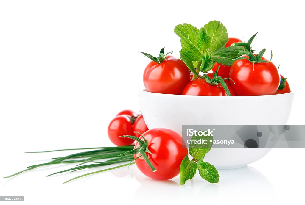 fresh tomatoes with green leaf fresh tomatoes with green leaf isolated on white background Composition Stock Photo