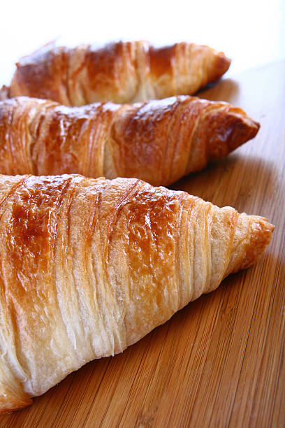 Croissants on wood table stock photo