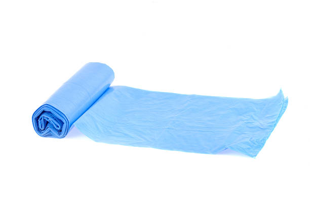 istock roll of blue garbage bags on the white background 153777835
