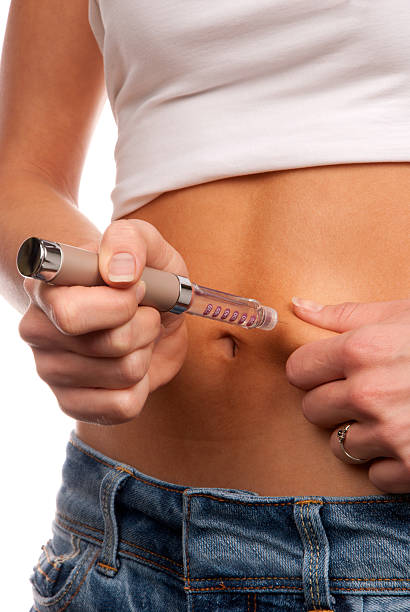 istock Insulin syringe pen abdomen injection 153778051