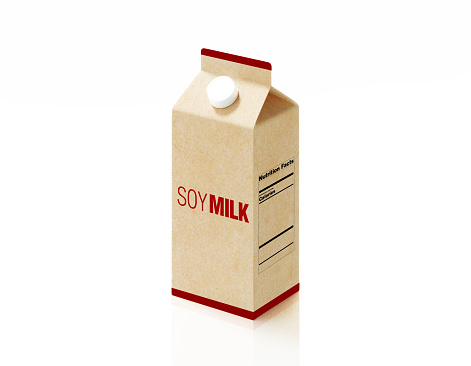 Soy milk logo printed milk package made of recycled paper on white background. Horizontal composition.