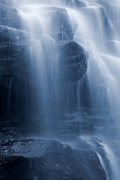 istock Misty Canyon Waterfall Cascade Dark Wet Rocks Selective Toning 153778407