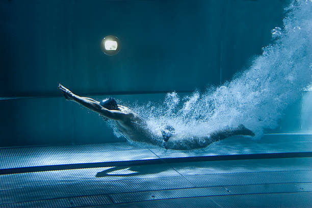 istock professional swimmer underwater after the jump 153778421