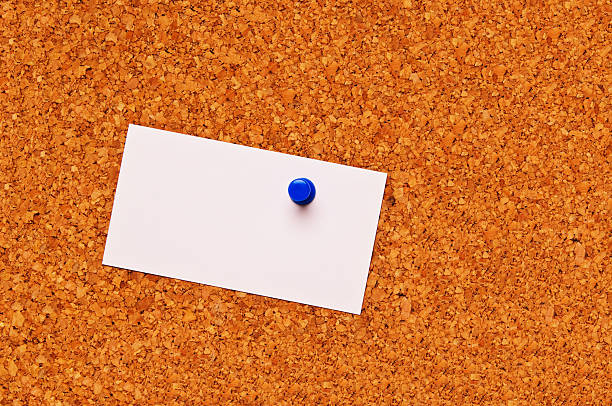 Blank business card on a cork board stock photo