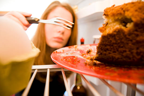 istock Girl eating cake from the fridge 153781130