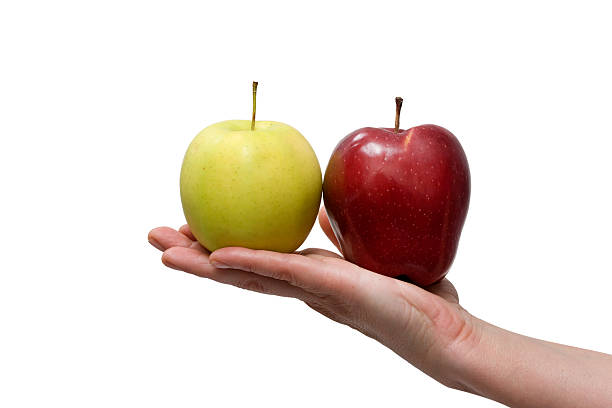 istock hands holding yellow and red apple 153781729