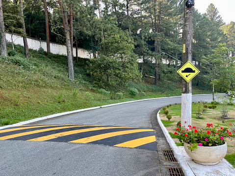 Speed bump sign indicating a speed bump on a city road, State of São Paulo, Brazil.