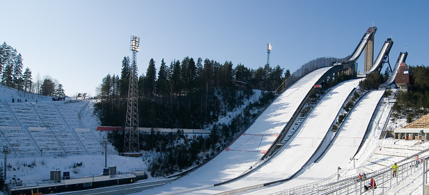 Famous ski jumping towers and arena in Lahti, Finland in early spring on a sunny day.