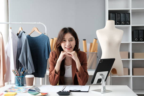 istock Asian female clothing designer working inside office. 1537825771