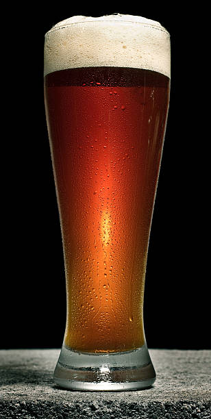 istock Beer in Pilsner Glass on Concrete with Head 153783449