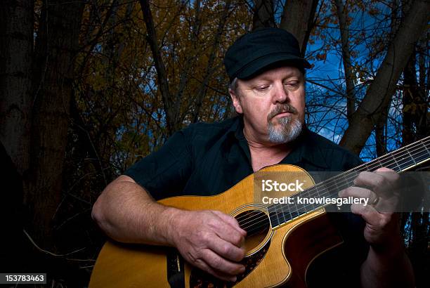 Guitar Man Plays In The Forest Stock Photo - Download Image Now - Acoustic Guitar, Country and Western Music, Guitar