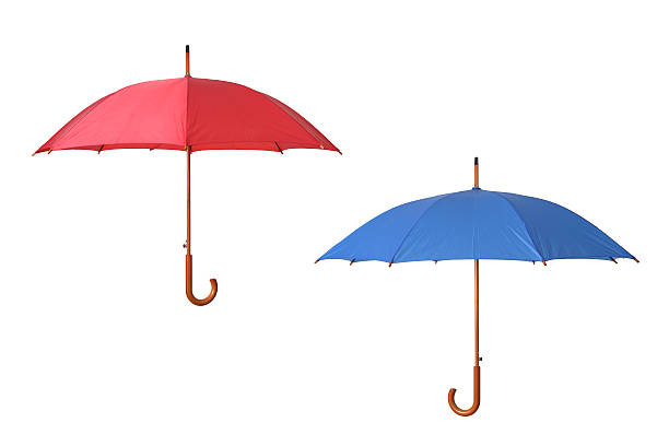 Red and blue umbrella on isolated white background stock photo