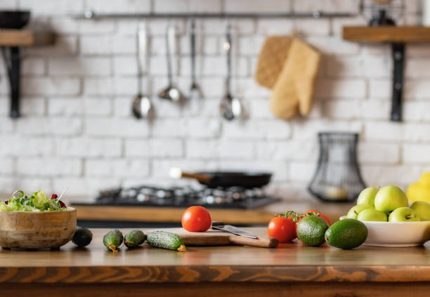 istock Kitchen table with various food vegetables and fruit for healthy and diet eating 1537838074