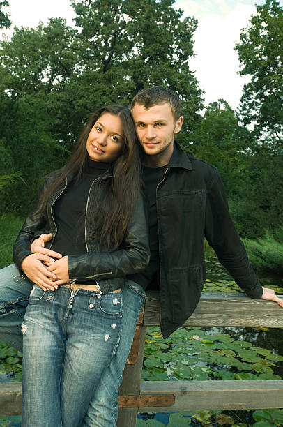 istock Young couple in park 153783811
