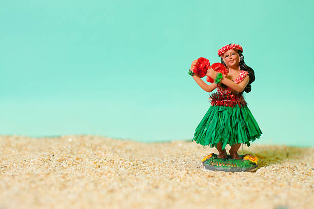 Hula Girl Doll on Sand stock photo