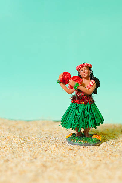 istock Hula Girl Toy on Beach 153784242