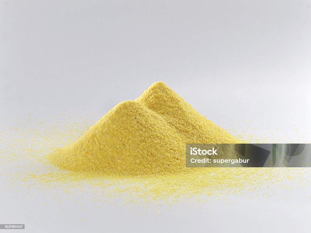 corn meal pile of corn meal on white background Color Image Stock Photo