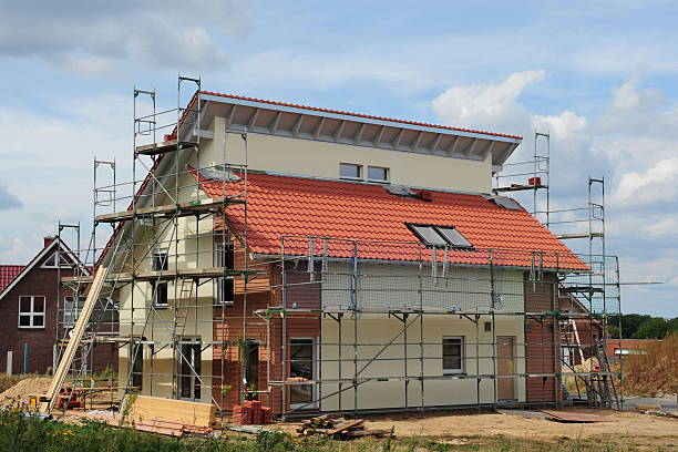 istock Scaffolding on a house with blue sky  153784476