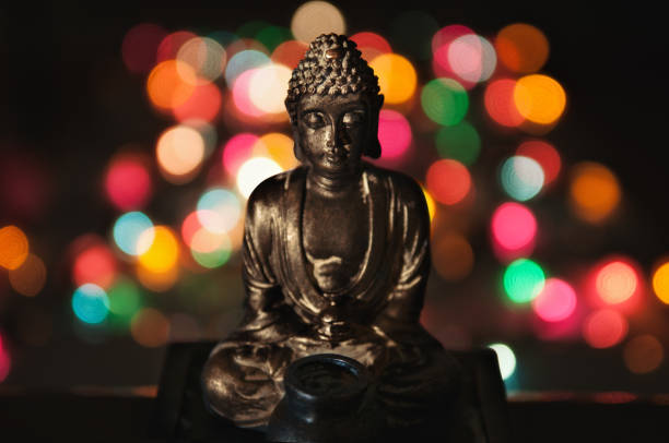 Buddha figure on multicolored background stock photo