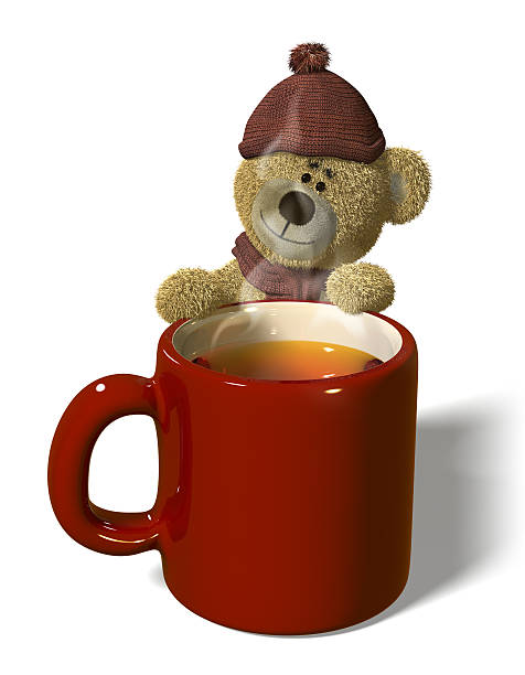 Nhi Bear wears a bobble hat and a scarf and stands behind a steaming mug of tea.