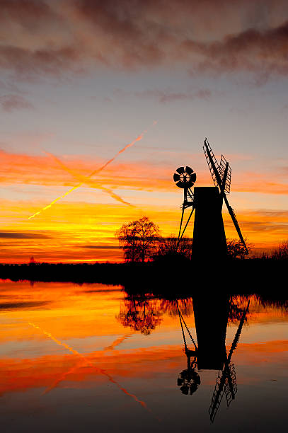 istock Turf fen wind pump at sunset 153785323