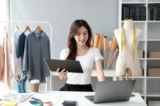 istock Asian female clothing designer working inside office. 1537857693