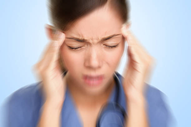 istock Nurse / doctor headache stress 153785797