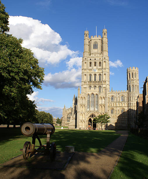 Front view of Ely Cathedral Front view of Ely Cathedral with a cannon on the foreground ely england photos stock pictures, royalty-free photos & images