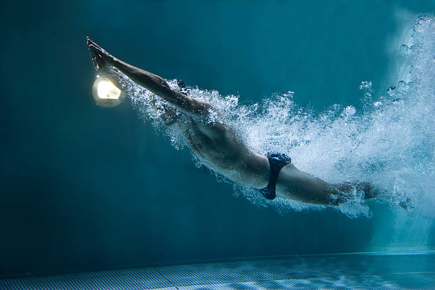 istock professional swimmer underwater after the jump 153786667