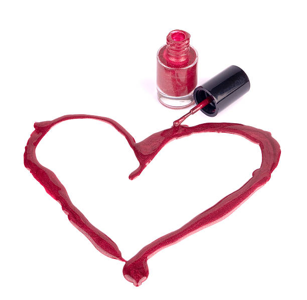 istock Red nail polish heart isolated on white 153786719