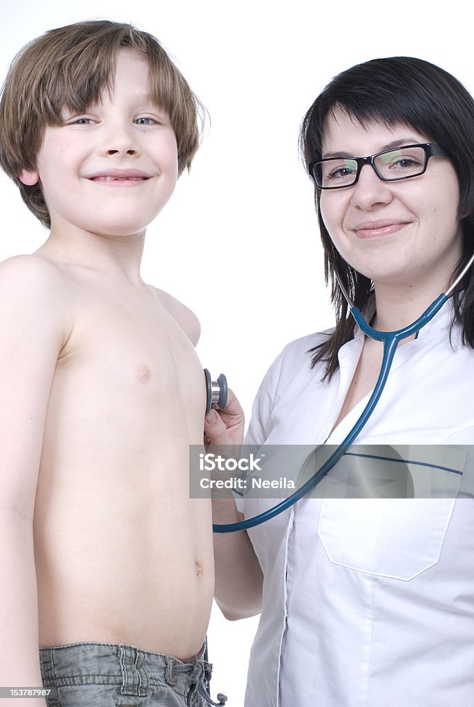 Sick boy Young boy examined by woman doctor Boys Stock Photo