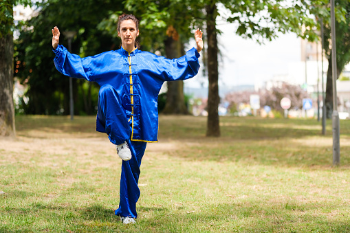 Middle-aged woman practicing Tai Chi