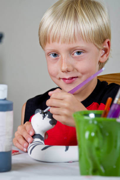 istock Caucasian Blond Little Boy Painting Pottery 153797688