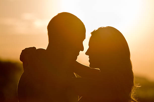 istock Happy Young Couple Silhouette 153797722