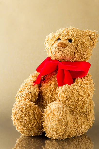 istock Golden Teddy with Red Bow 153797855