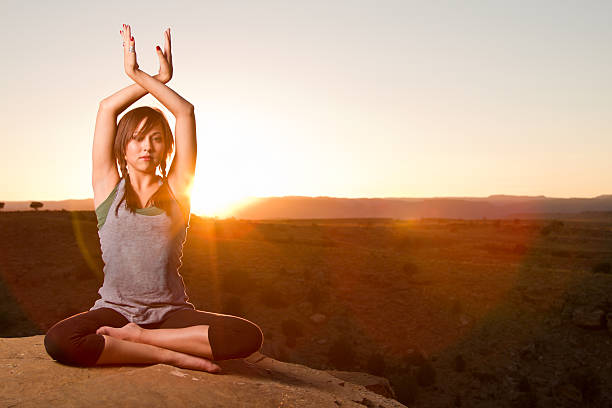 istock Young Woman Doing Yoga at Sunset 153798114