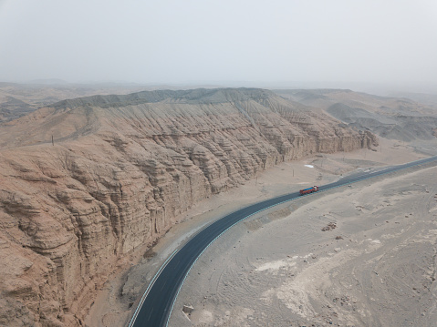 View of a highway the mountains in the Aksu Prefecture Karakoram Range and desert edgeView from an Aerial view