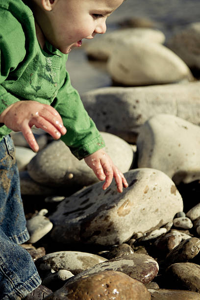 istock Toddler Boy Splashing in a pond 153800379
