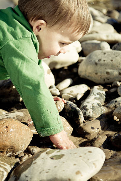 istock Toddler Boy Splashing in a pond 153800395