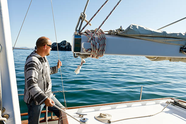 istock Mature Man on Sailboat 153800808